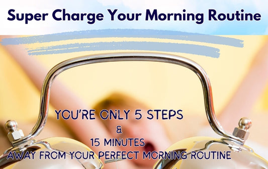 Super Charge Your Mornings. How to start a morning routine. Alarm clock in foreground and woman in bed yawning with arms in the air in background. 