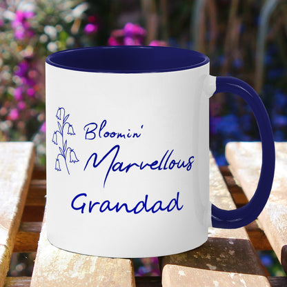 Garden  plant theme mug. Personalised name, White ceramic 11oz coffee cup with navy blue handle and inner. Floral design navy blue bluebells outline and wording Bloomin Marvellous in script style font next to flowers. Personalisation Grandad below.