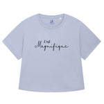 Serene light blue ladies T-Shirt with dolman sleeve, rib neck collar and sleeve cuff fold. Oversized women’s t-shirt with a short sleeves, inspired by the 1990s oversize trend.. Black slogan script font design reads French phrase C'est Magnifique