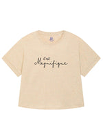 Rainbow heather beige/cream ladies T-Shirt with dolman sleeve, rib neck collar and sleeve cuff fold. Rainbow Heather - light beige/cream base colour with multicolour flecks. Oversized women’s t-shirt with a short sleeves, inspired by the 1990s oversize trend.. Black slogan script font design reads French phrase C'est Magnifique