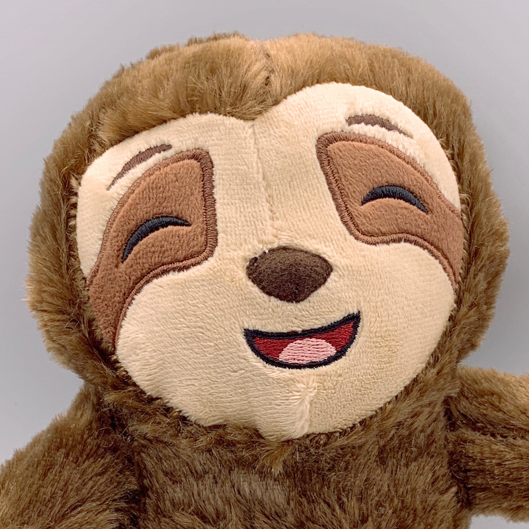 Close up of Cuddly Baby Sloth Stuffed Toys by Sense of Calm. Musical Toys for Babies and Toddlers. Soothe to sleep with lullaby comforter