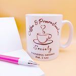 Coffee lover ceramic mug gift. White coffee mug with cup and saucer design. Black outline with steam up from cup shaped into a heart. Writing above design reads Coffee & Procrastination. Below design reads ...Society FOUNDING MEMBER Est. 7am Blank notepad and pen to left of the 10oz mug