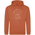 Burnt orange 'Ginger Biscuit' Coffee lover themed relaxed fit unisex hoodie. Men / Womens orange colour hoodie top with coffee mug with cup and saucer design. Cream outline with steam up from cup shaped into a heart. Writing above design reads Coffee & Pr