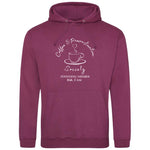 Plum Coffee lover themed relaxed fit unisex hoodie. Men / Womens pink / purple hoodie top with coffee mug with cup and saucer design. White outline with steam up from cup shaped into a heart. Writing above design reads Coffee & Procrastination. Below desi