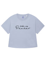 Light blue womens oversized T-shirt with loose sleeves with roll cuffs. The ladies tshirt has the french words Voulez Vous Danser in black