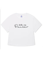 White womens oversized T-shirt with loose sleeves with roll cuffs. The ladies tshirt has the french words Voulez Vous Danser in black 