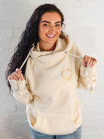 Womens Cowl Neck Hoodie - Cotton Vanilla cream hoodie with gold metallic love heart motif. Long sleeves and thumb loops to cuffs. Front kangaroo pouch pocket. Cross neck sweatshirt with hood with silver metal eyelets for thick fabric drawstrings and silver metallic toggle. Cosy casual wear autumn / winter ladies hoodie 