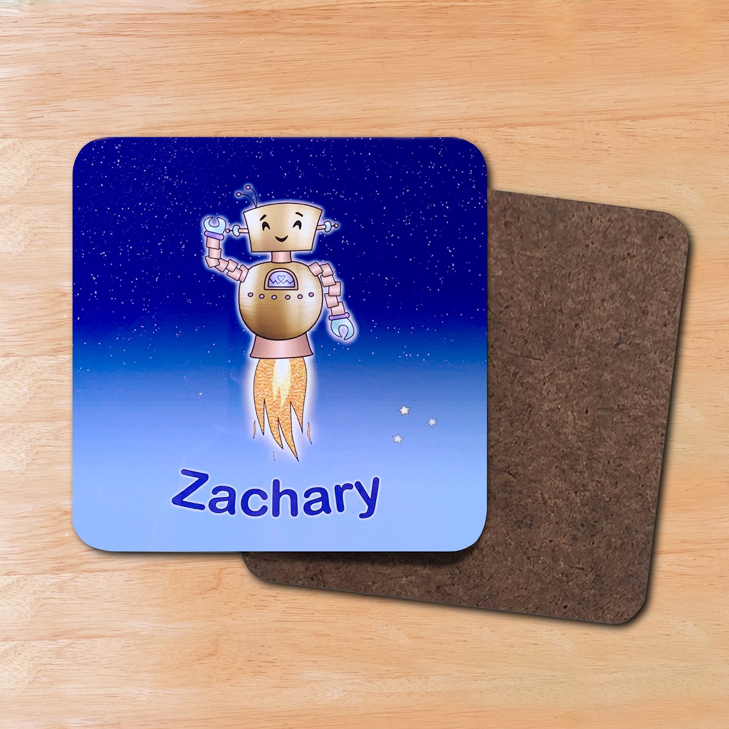 Blue star sky kids coaster wooden backing.   Gold Robot smiling with jets flying into space. Personalised with boy's name at the bottom of custom child's drinks coaster. 