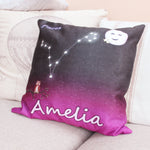 Personalised cushion next to her with zodiac sign Virgo. Space backdrop black sky with stars fading to deep pink purple hue at bottom of the cusion. Personalised with girls name at the bottom, Small owl on a branch to the left of star sign constellation at centre and top right cute smiling moon and two stars. 18 inch faux suede home decor constellation cushion