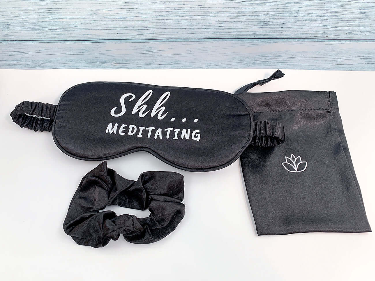 satin black sleep mask with 'Shh...meditating' matching hair scrunchie and satin small black storage bag