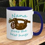 Personalised Tea / Coffee cup gift. Cute cuddly three toed sloths on a branch. Mum and baby. Two tone white with navy blue ceramic coffee mug. Customisable name reads Nana gives the best hugs in light blue font.