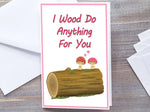 Cute Mushroom / Toadstool woodland theme Greetings card for 5 year wood anniversary or valentines. White card of 2 toadstool mushrooms on top of wooden log smiling together with two hearts floating just above them. Wording I wood do Anything for You in red text above image Red and white polkadot spotty thin border. Placed on grey wood surface with white envelope