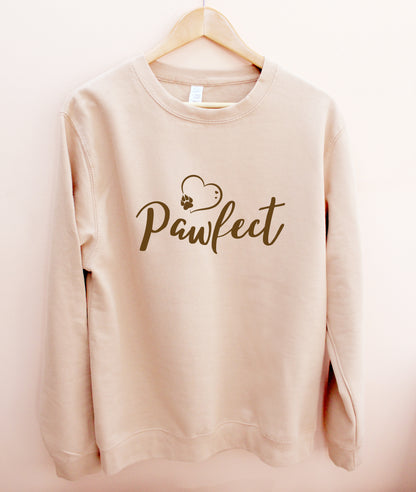 Beige / Caramel colour relaxed fit long sleeve sweatshirt on wooden hanger Slogan sweater design wording Pawfect in brown font and brown heart outline above with dog paw print within outline.