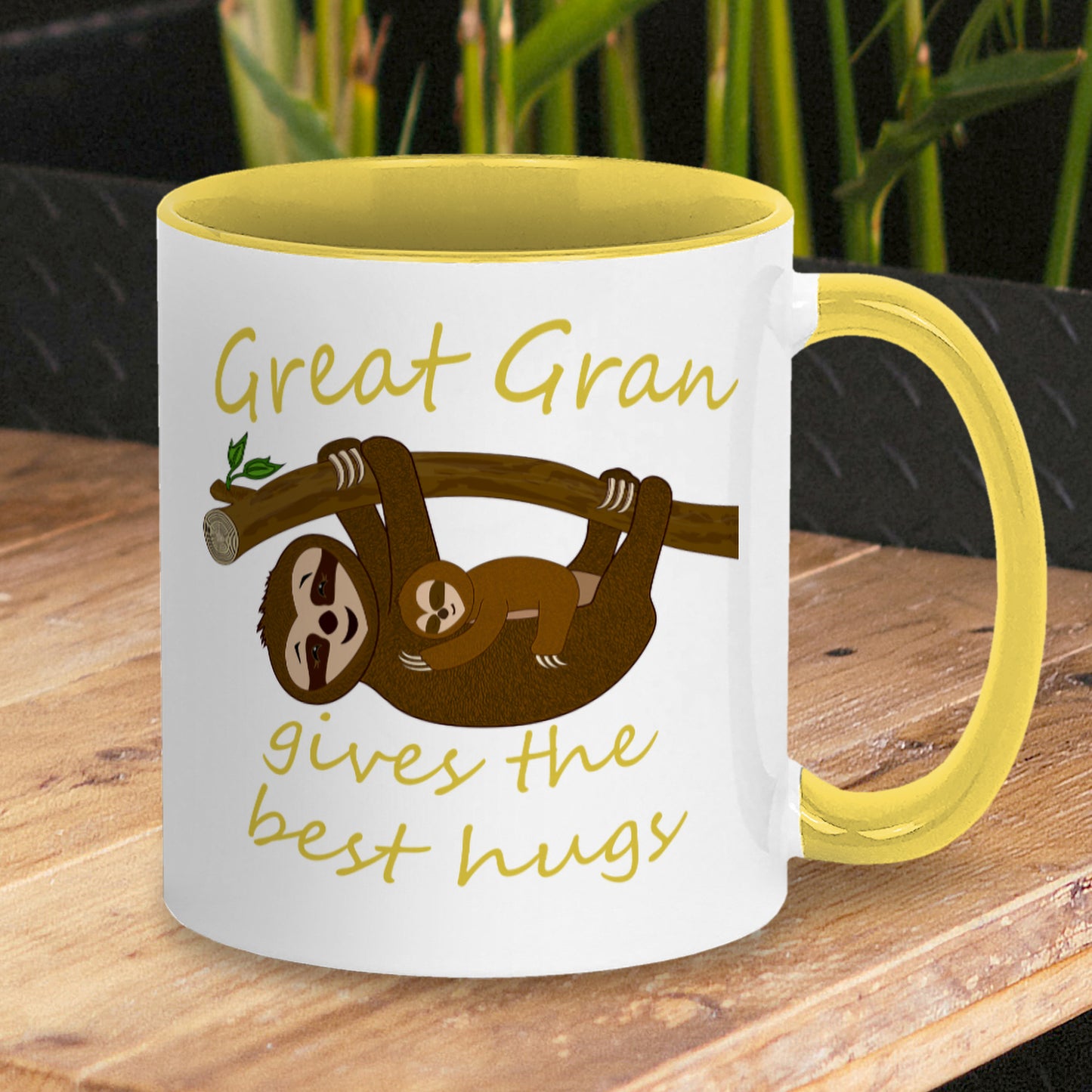 Personalised Tea / Coffee cup gift. Cute cuddly three toed sloths on a branch. Mum and baby. Two tone white with yellow ceramic coffee mug. Customisable name reads Great Gran gives the best hugs in yellow font.